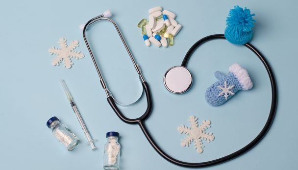 Stethoscope,,Vaccine,,Pills,On,A,Blue,Medical,Background.,The,Concept